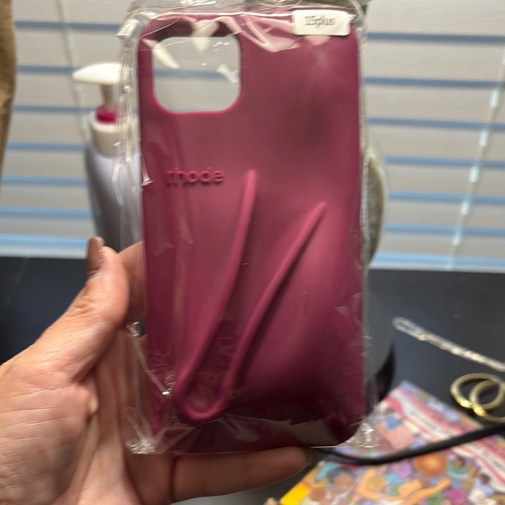 RHODE Magenta iPhone 15 plus case with matching lipgloss.